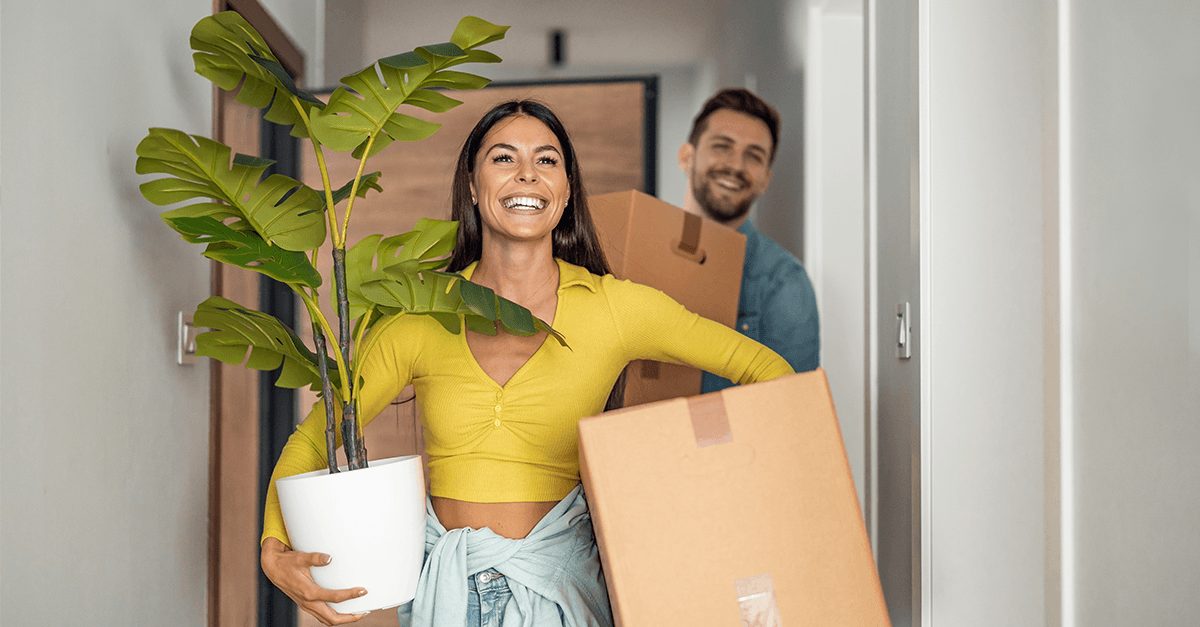 A couple moving into their new home.